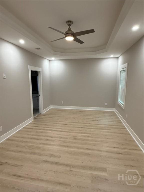 2310 Coakley St, Savannah, GA 31404 - spare room with light wood-type flooring, ceiling fan, a raised ceiling, and recessed lighting