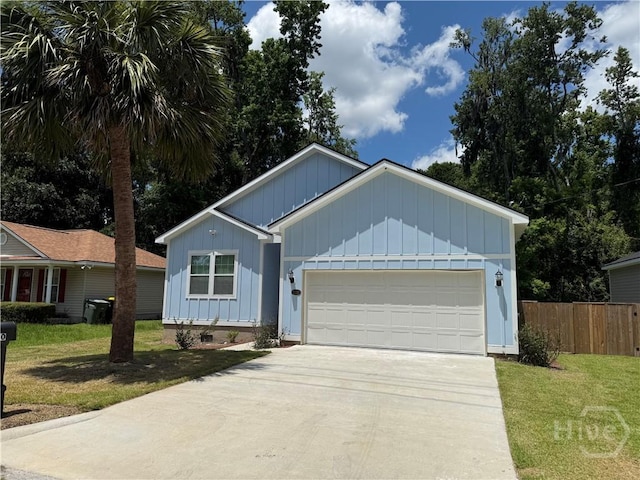 2310 Coakley St, Savannah, GA 31404 - ranch-style house with board and batten siding, a garage, and concrete driveway