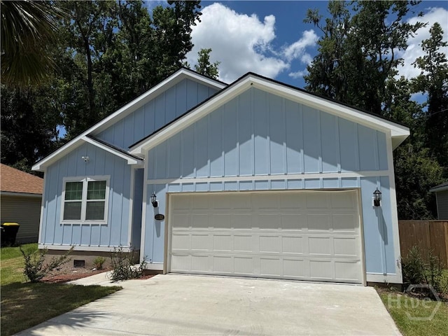 2310 Coakley St, Savannah, GA 31404 - ranch-style house featuring board and batten siding, an attached garage, and driveway