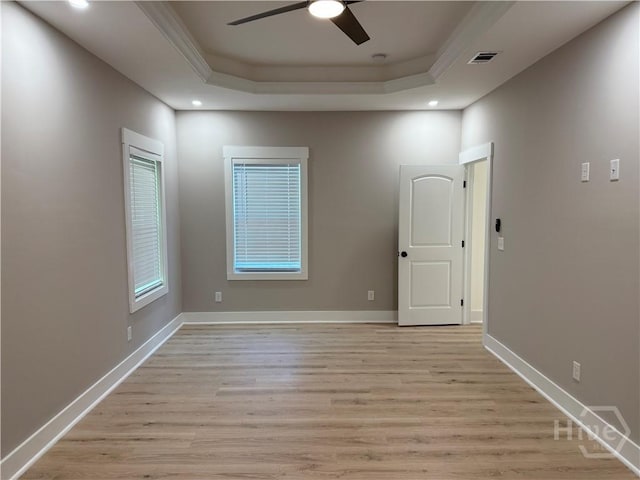 2310 Coakley St, Savannah, GA 31404 - empty room with a raised ceiling, light wood-type flooring, a ceiling fan, ornamental molding, and recessed lighting