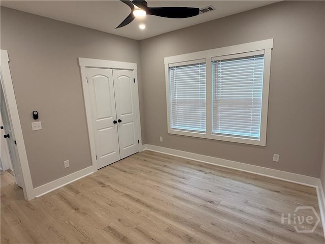 2310 Coakley St, Savannah, GA 31404 - unfurnished bedroom featuring light wood-style floors, a ceiling fan, and a closet