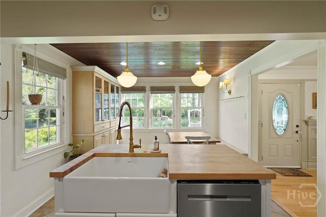 209 E 66th St, Savannah, GA 31405 - kitchen featuring dishwasher, wood ceiling, wood counters, pendant lighting, and a center island with sink