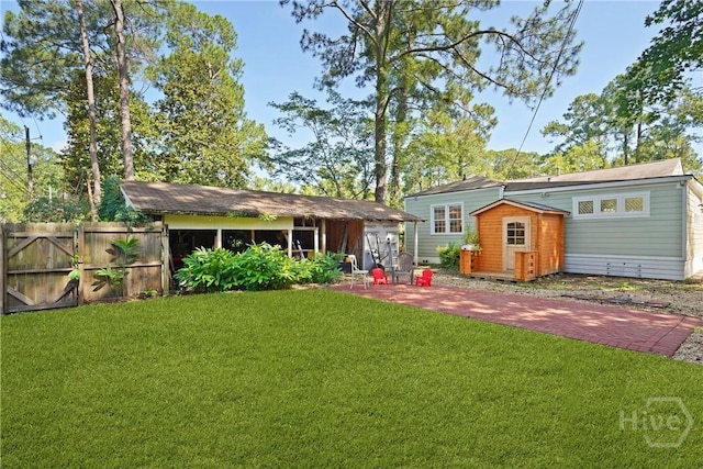 209 E 66th St, Savannah, GA 31405 - rear view of property with an outdoor structure and a patio