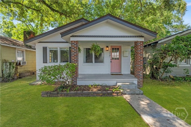 731 E 34th St, Savannah, GA 31401 - bungalow-style home featuring covered porch, a front yard, and cooling unit