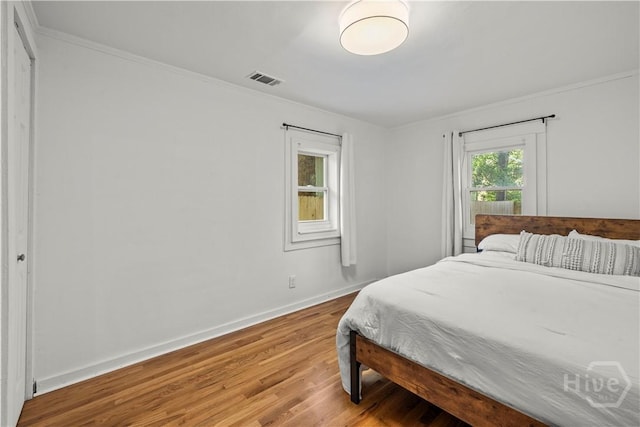 731 E 34th St, Savannah, GA 31401 - bedroom with wood finished floors and crown molding