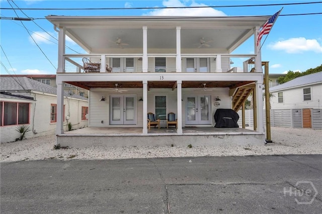 13 Izlar Ave, Tybee Island, GA 31328 - rear view of property featuring french doors, ceiling fan, and a balcony