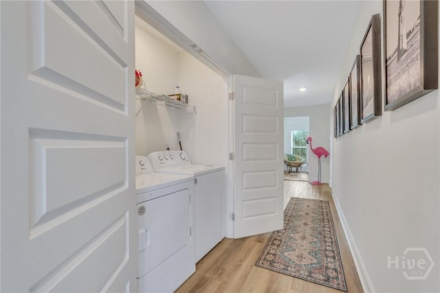 13 Izlar Ave, Tybee Island, GA 31328 - laundry area featuring separate washer and dryer, light wood finished floors, and recessed lighting