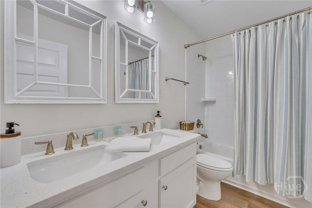 13 Izlar Ave, Tybee Island, GA 31328 - full bathroom with double vanity, shower / bathtub combination with curtain, and wood finished floors