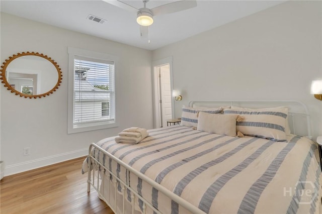 13 Izlar Ave, Tybee Island, GA 31328 - bedroom with wood finished floors and ceiling fan