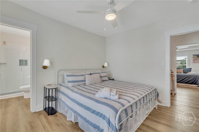13 Izlar Ave, Tybee Island, GA 31328 - bedroom featuring wood finished floors, connected bathroom, and ceiling fan