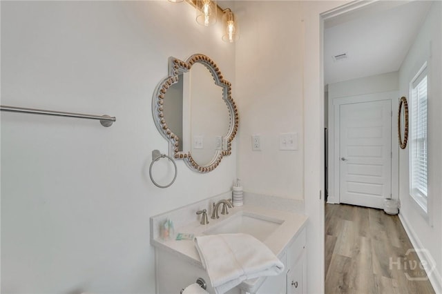 13 Izlar Ave, Tybee Island, GA 31328 - bathroom featuring vanity and wood finished floors