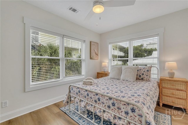 13 Izlar Ave, Tybee Island, GA 31328 - bedroom with wood finished floors and a ceiling fan