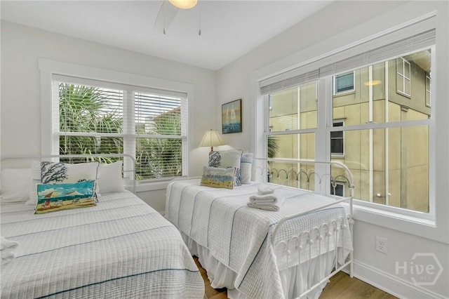 13 Izlar Ave, Tybee Island, GA 31328 - bedroom featuring wood finished floors and a ceiling fan