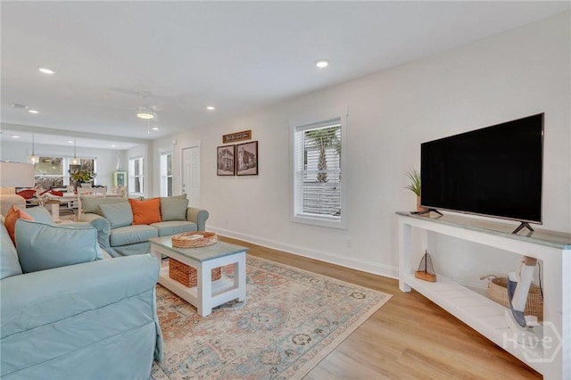 13 Izlar Ave, Tybee Island, GA 31328 - living room with plenty of natural light, light wood-style flooring, ceiling fan, and recessed lighting