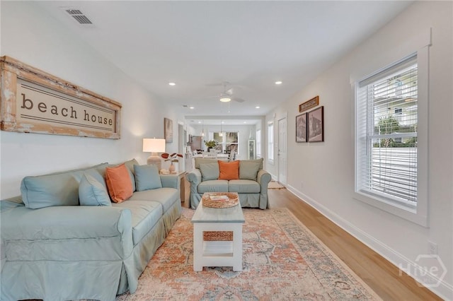 13 Izlar Ave, Tybee Island, GA 31328 - living room featuring wood finished floors, healthy amount of natural light, ceiling fan, and recessed lighting