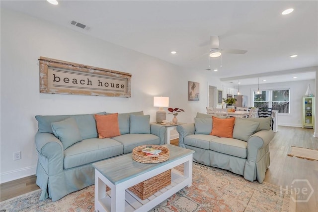 13 Izlar Ave, Tybee Island, GA 31328 - living room featuring light wood-style floors, a ceiling fan, and recessed lighting