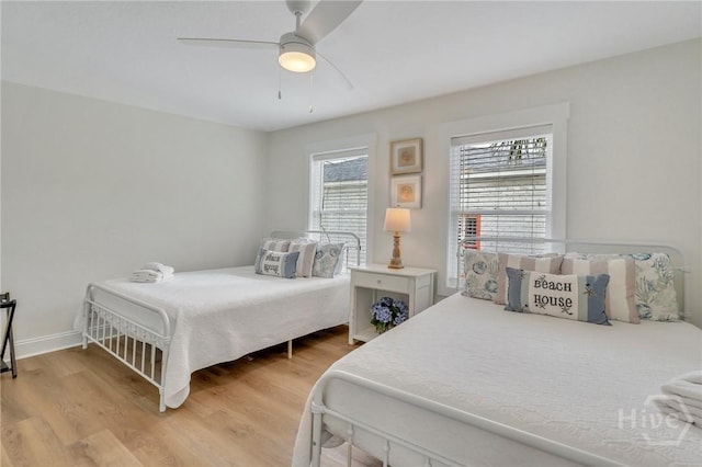 13 Izlar Ave, Tybee Island, GA 31328 - bedroom with light wood-style floors and ceiling fan