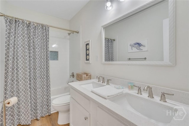 13 Izlar Ave, Tybee Island, GA 31328 - bathroom with wood finished floors, double vanity, and shower / tub combo with curtain