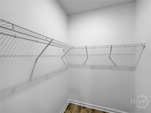 1031 Milton St, Savannah, GA 31405 - walk in closet featuring wood finished floors