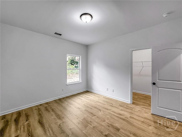 1031 Milton St, Savannah, GA 31405 - spare room with light wood-style floors and a smoke detector