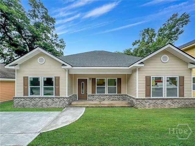 1031 Milton St, Savannah, GA 31405 - single story home featuring a front lawn, covered porch, brick siding, and a shingled roof