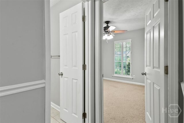 904 Mill Dr, Savannah, GA 31419 - corridor featuring a textured ceiling and light colored carpet