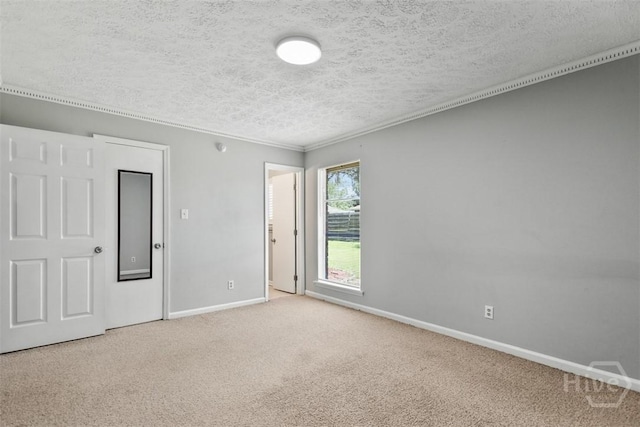 904 Mill Dr, Savannah, GA 31419 - carpeted empty room with baseboards and a textured ceiling