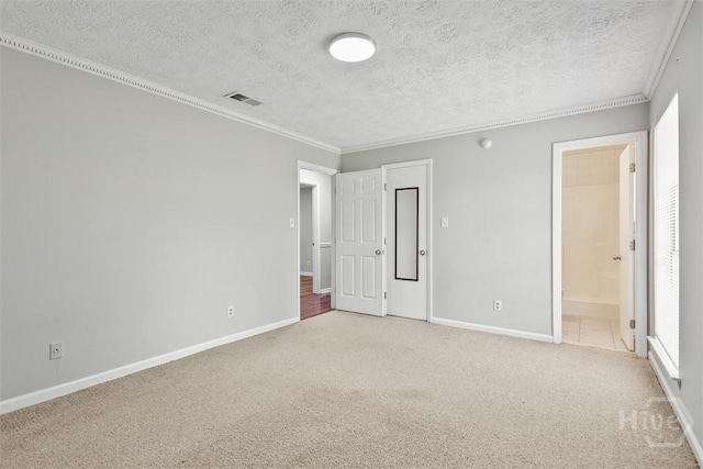 904 Mill Dr, Savannah, GA 31419 - unfurnished bedroom with carpet flooring, crown molding, a textured ceiling, and ensuite bath