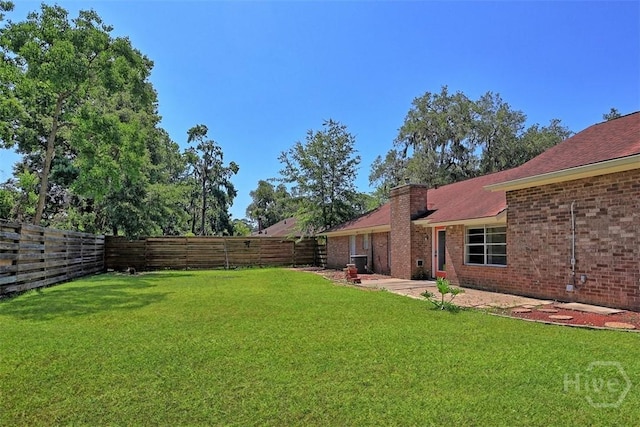 904 Mill Dr, Savannah, GA 31419 - fenced backyard with a patio area