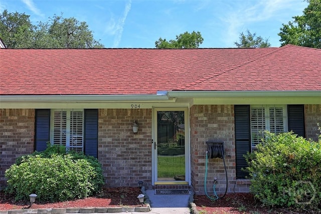 904 Mill Dr, Savannah, GA 31419 - doorway to property with a shingled roof and brick siding