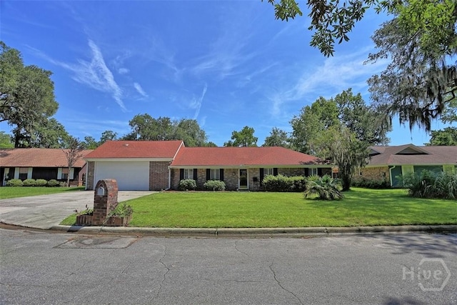 904 Mill Dr, Savannah, GA 31419 - single story home with driveway, a front lawn, and an attached garage