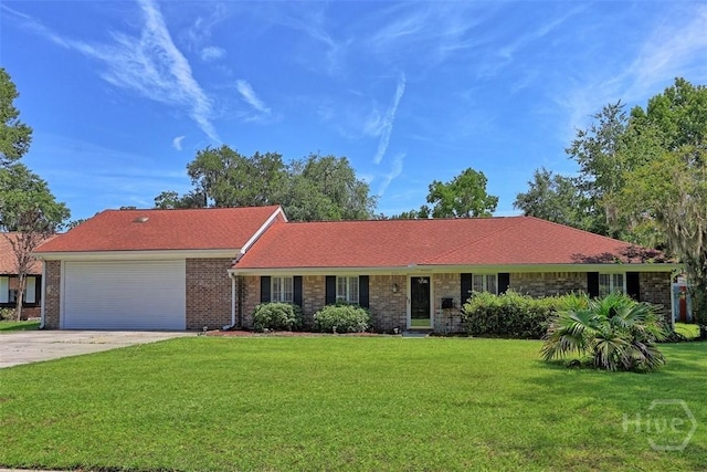 904 Mill Dr, Savannah, GA 31419 - ranch-style house with concrete driveway, a garage, a front lawn, and brick siding