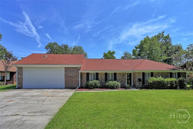 904 Mill Dr, Savannah, GA 31419 - single story home with a front yard, a garage, driveway, and brick siding