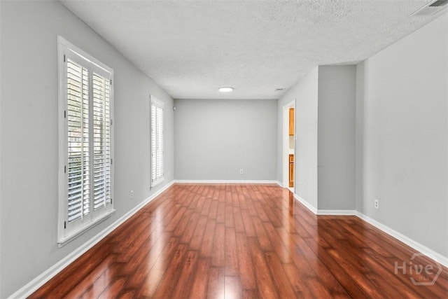 904 Mill Dr, Savannah, GA 31419 - spare room with wood-type flooring and a textured ceiling