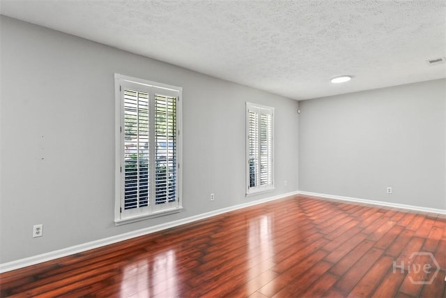 904 Mill Dr, Savannah, GA 31419 - unfurnished room with wood finished floors and a textured ceiling