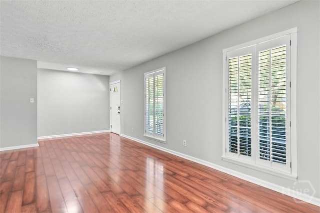 904 Mill Dr, Savannah, GA 31419 - spare room with wood finished floors and a textured ceiling