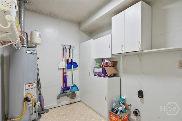 904 Mill Dr, Savannah, GA 31419 - washroom featuring water heater and cabinet space