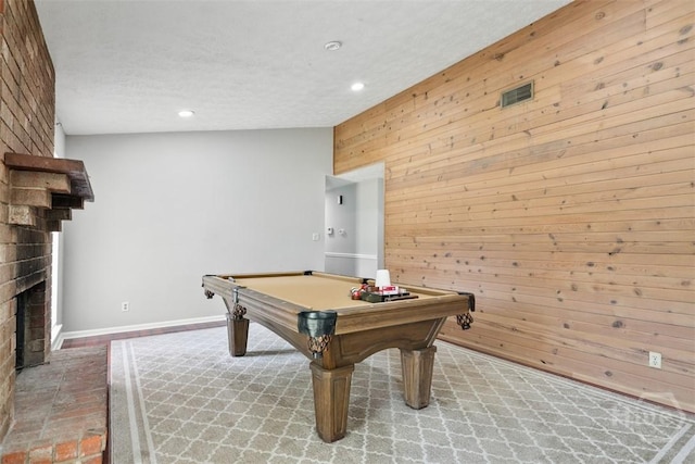 904 Mill Dr, Savannah, GA 31419 - game room featuring wooden walls, recessed lighting, a brick fireplace, pool table, and a textured ceiling