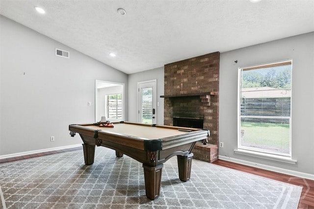 904 Mill Dr, Savannah, GA 31419 - recreation room with a textured ceiling, healthy amount of natural light, lofted ceiling, a fireplace, and recessed lighting