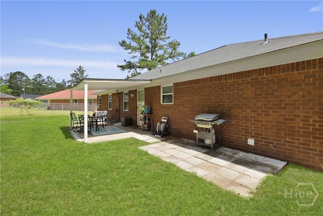 340 Hunters Branch Dr, Allenhurst, GA 31301 - back of house with a patio area and brick siding