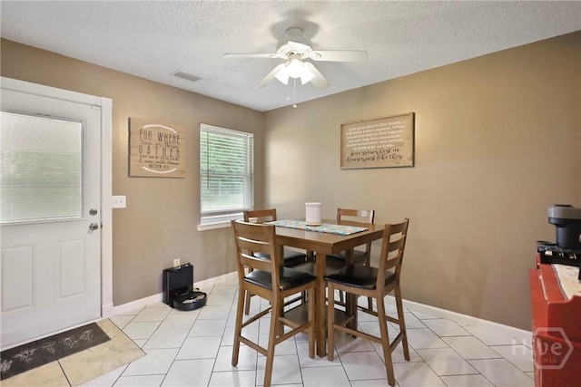 340 Hunters Branch Dr, Allenhurst, GA 31301 - dining space featuring ceiling fan, a textured ceiling, and light tile patterned flooring