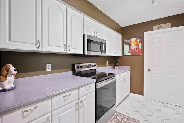 340 Hunters Branch Dr, Allenhurst, GA 31301 - kitchen featuring appliances with stainless steel finishes and white cabinets