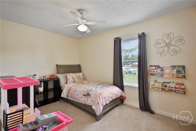340 Hunters Branch Dr, Allenhurst, GA 31301 - bedroom with multiple windows, carpet, ceiling fan, and a textured ceiling