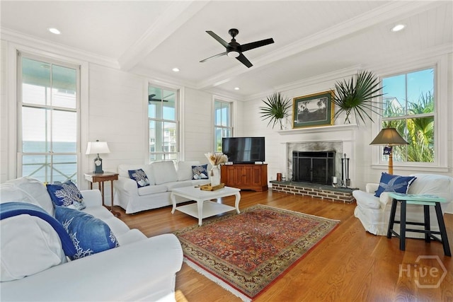 3 Palmwood Ct, Tybee Island, GA 31328 - living room with ornamental molding, a brick fireplace, wood finished floors, ceiling fan, and beamed ceiling