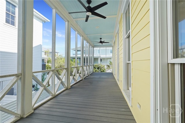 3 Palmwood Ct, Tybee Island, GA 31328 - unfurnished sunroom featuring a ceiling fan and wood finished floors