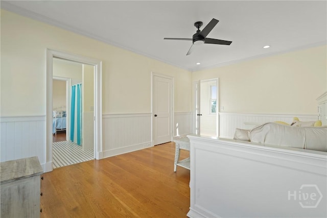 3 Palmwood Ct, Tybee Island, GA 31328 - bedroom with a wainscoted wall, wood finished floors, ceiling fan, and recessed lighting