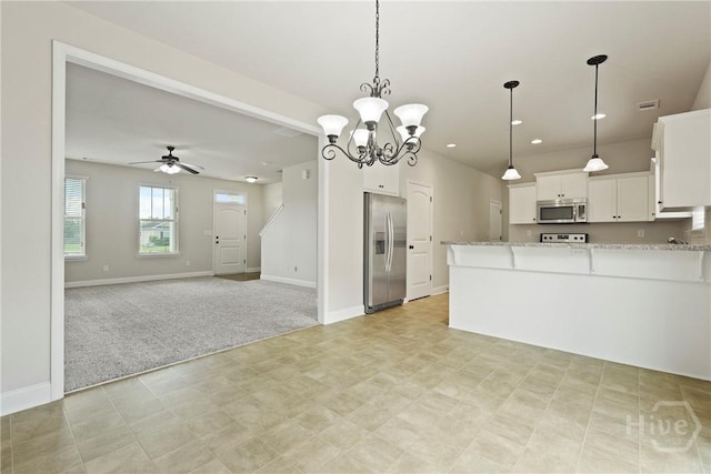 153 Whirlwind Way, Guyton, GA 31312 - kitchen with appliances with stainless steel finishes, light carpet, open floor plan, a peninsula, and recessed lighting