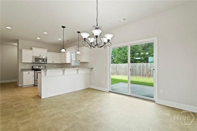 153 Whirlwind Way, Guyton, GA 31312 - kitchen with appliances with stainless steel finishes, white cabinets, a chandelier, hanging light fixtures, and a peninsula