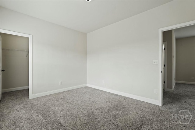 153 Whirlwind Way, Guyton, GA 31312 - unfurnished bedroom with carpet floors, a walk in closet, attic access, and a closet