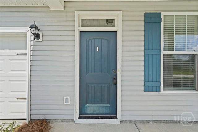 153 Whirlwind Way, Guyton, GA 31312 - property entrance with a garage